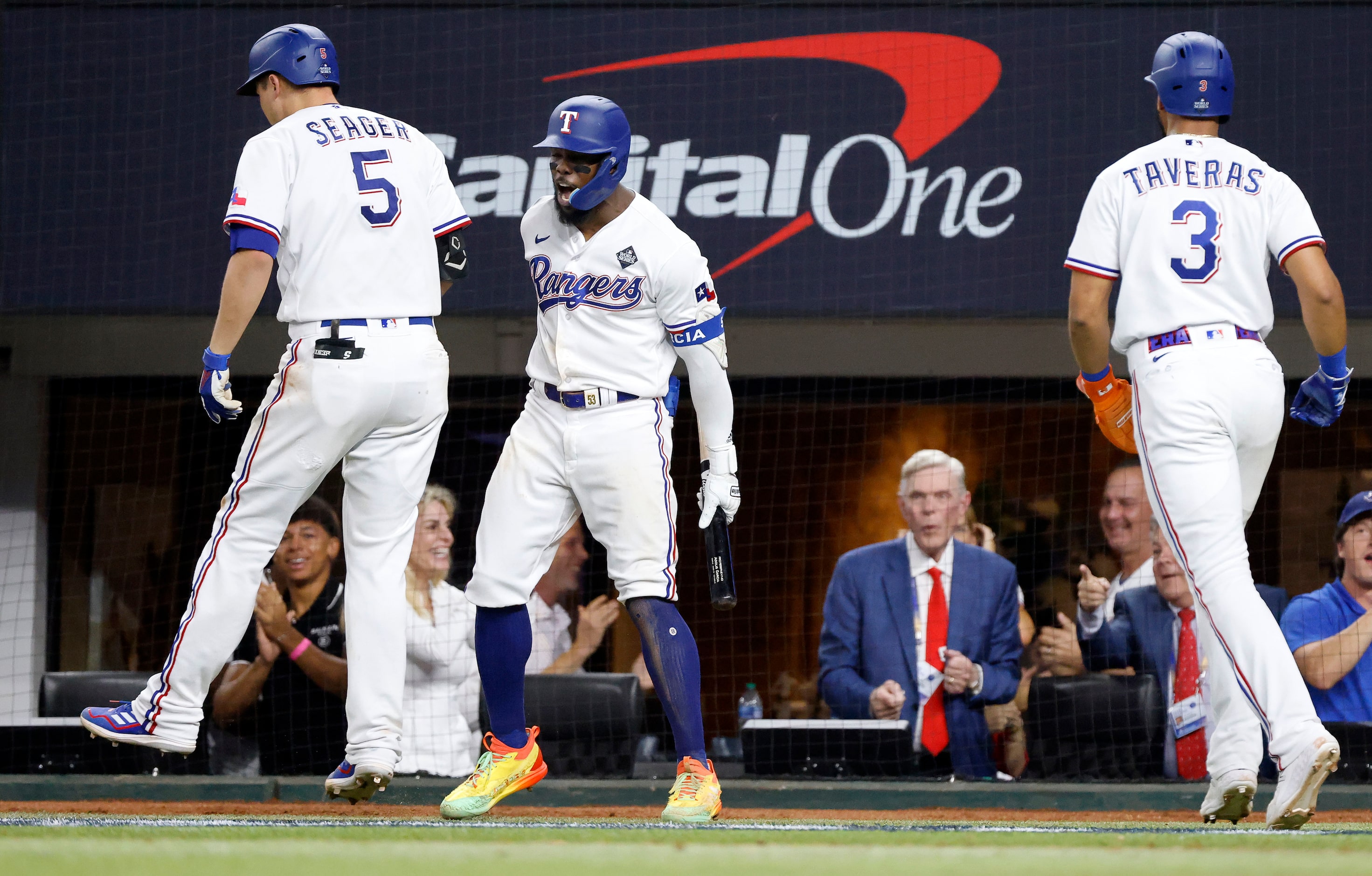 Texas Rangers right fielder Adolis Garcia (53) congratulates Texas Rangers shortstop Corey...