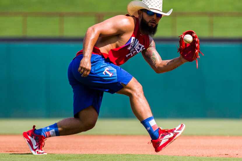 Texas Rangers second baseman Rougned Odor (12) catches a throw during batting practice...