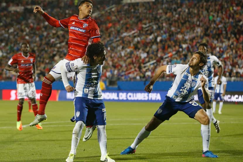 FC Dallas forward Cristian Colman (9) heads the ball over Pachuca defender Jorge Hernandez...