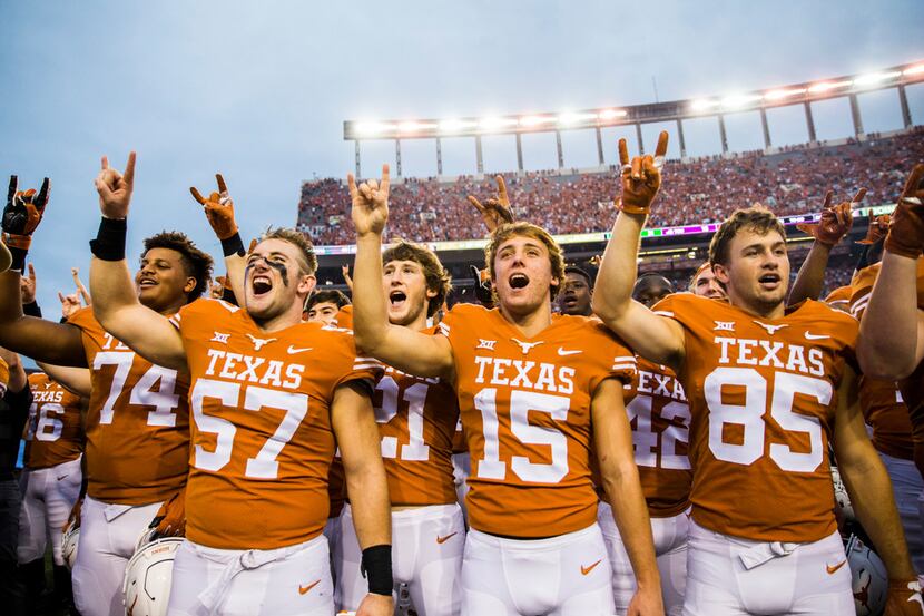 Texas Longhorns celebrate a 31-16 win over the TCU Horned Frogs on Saturday, September 22,...