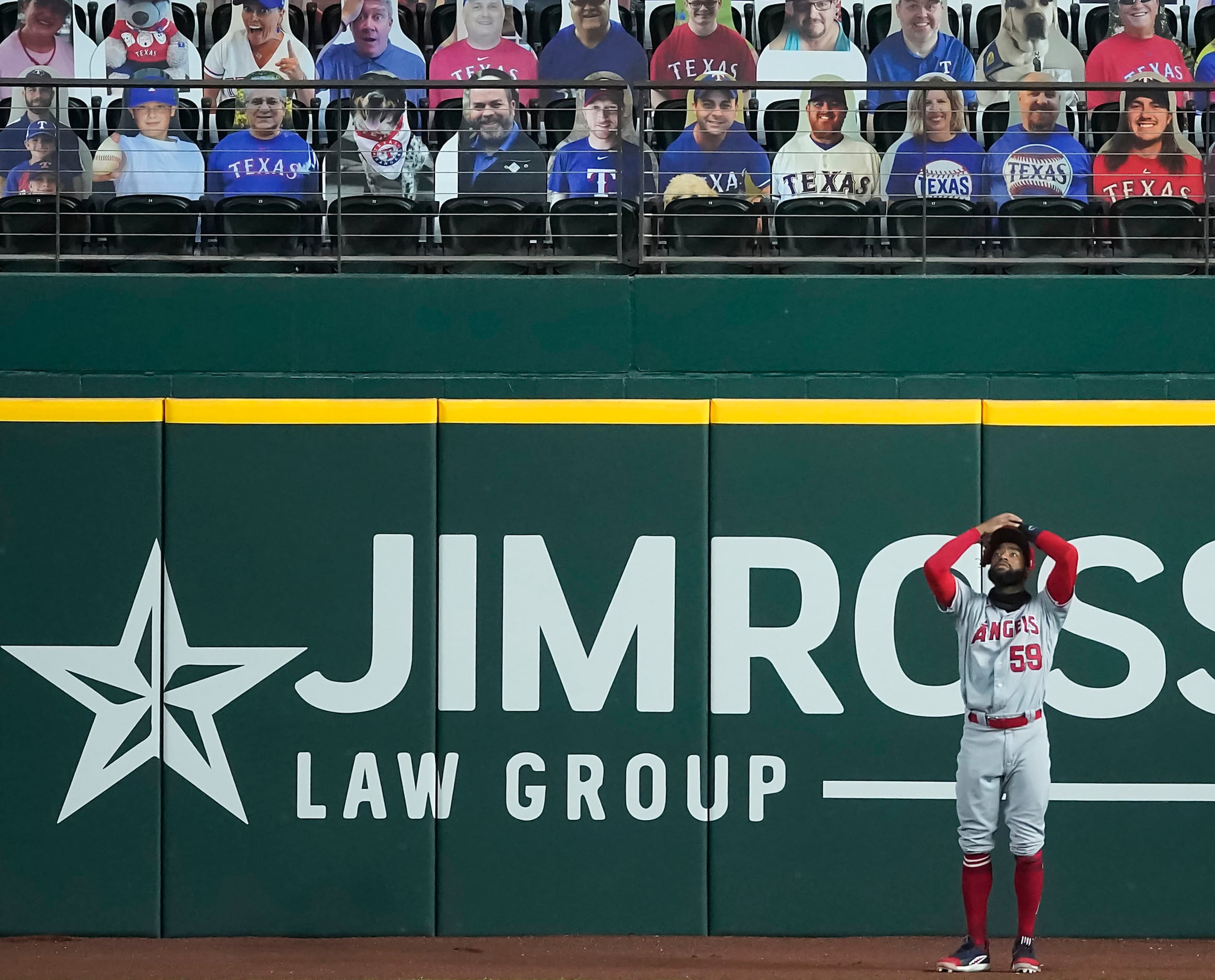 SEQUENCE FOUR-OF-FOUR: Los Angeles Angels right fielder Jo Adell reacts after having a ball...