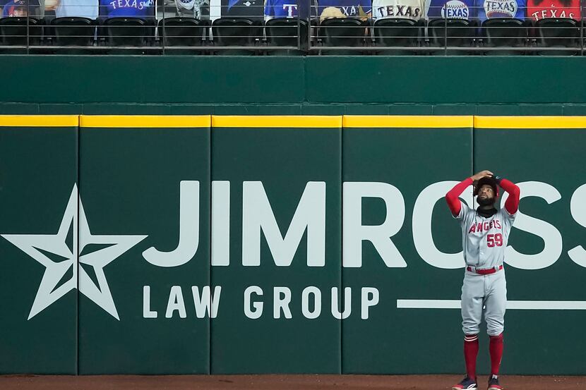 SEQUENCE FOUR-OF-FOUR: Los Angeles Angels right fielder Jo Adell reacts after having a ball...