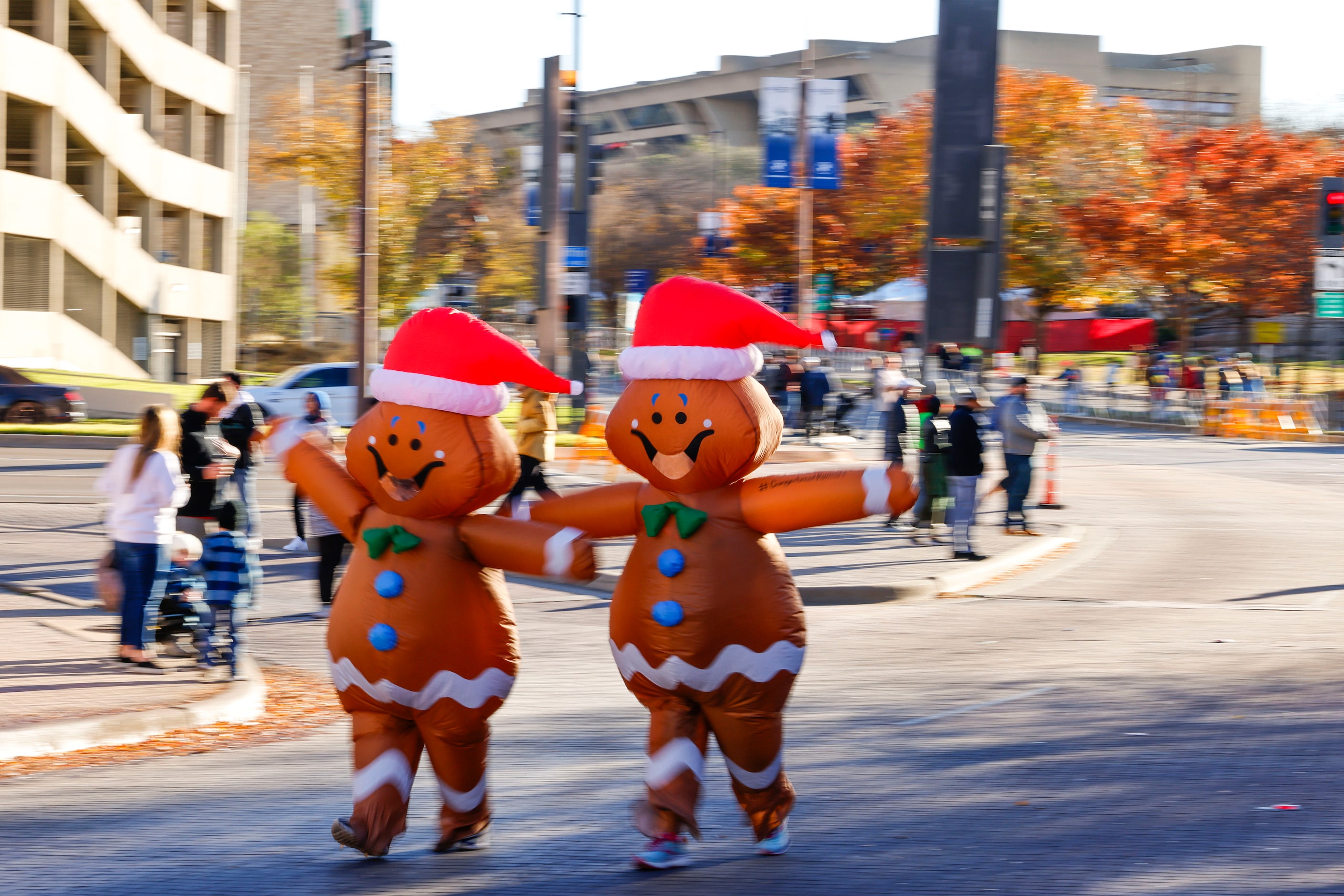 Runners wearing Christmas inflatable costume take part in 2023 BMW Dallas Marathon on,...