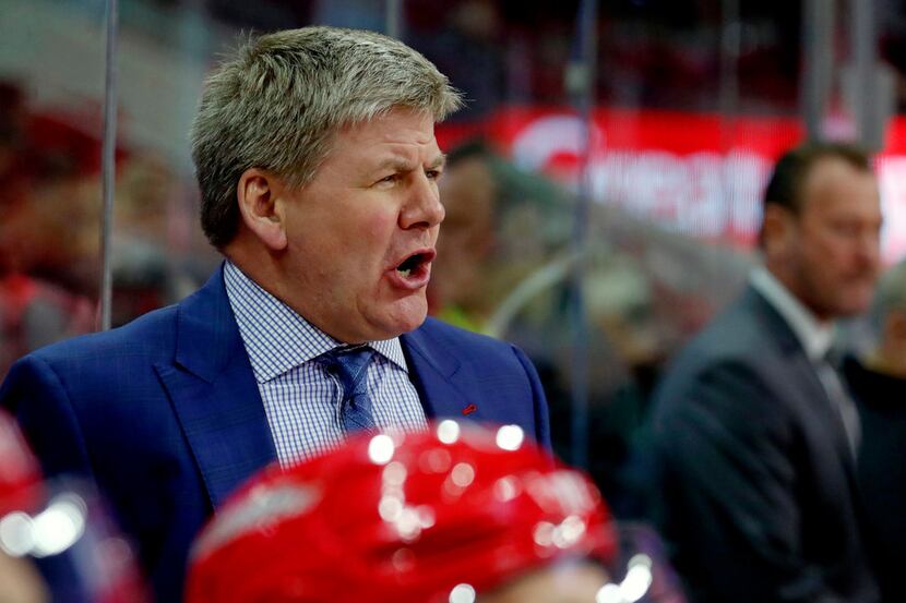 Carolina Hurricanes head coach Bill Peters directs the team during the first period against...