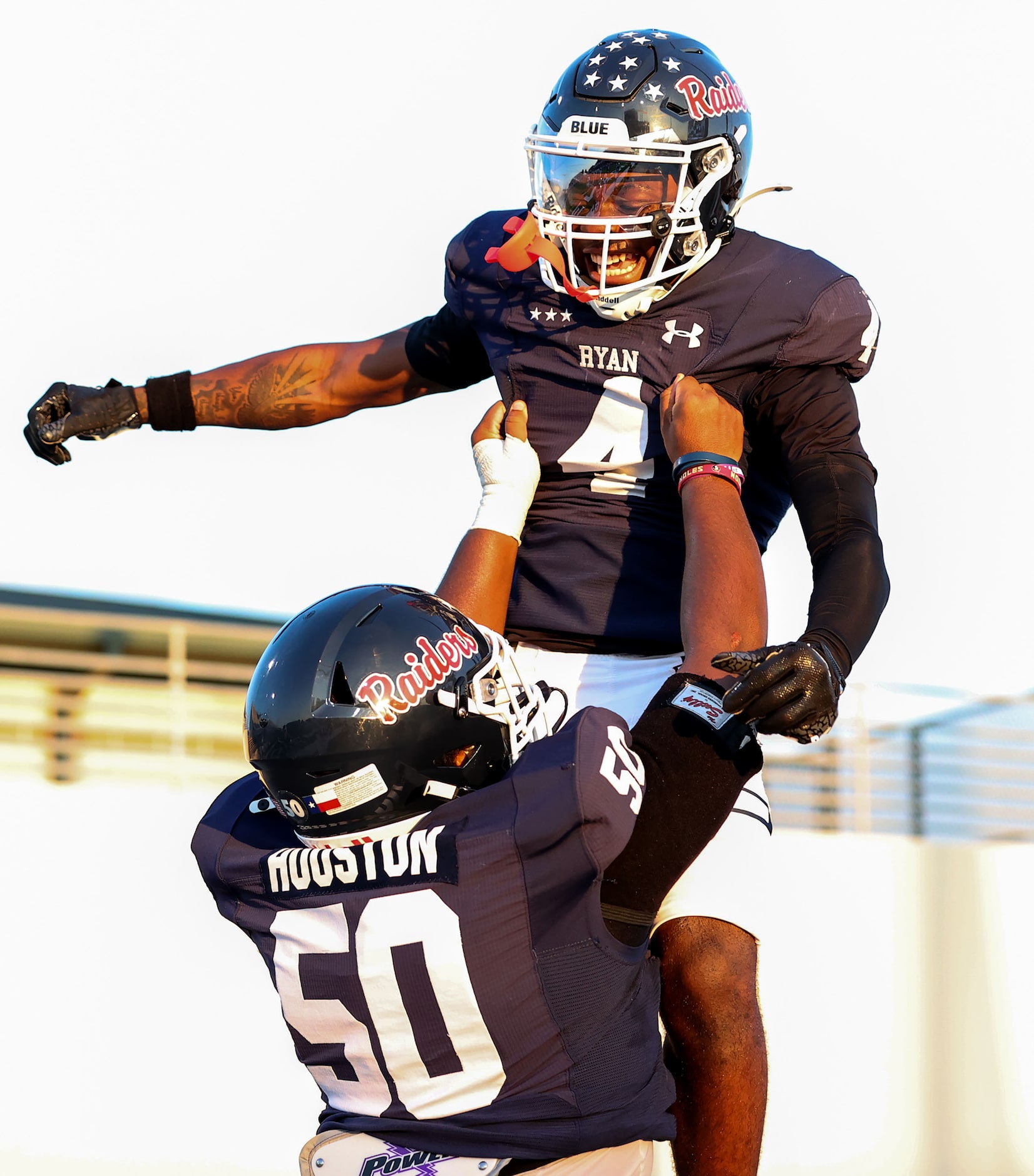 Denton Ryan running back Tre'Vaughn Reynolds (4) celebrates with offensive lineman Kingston...