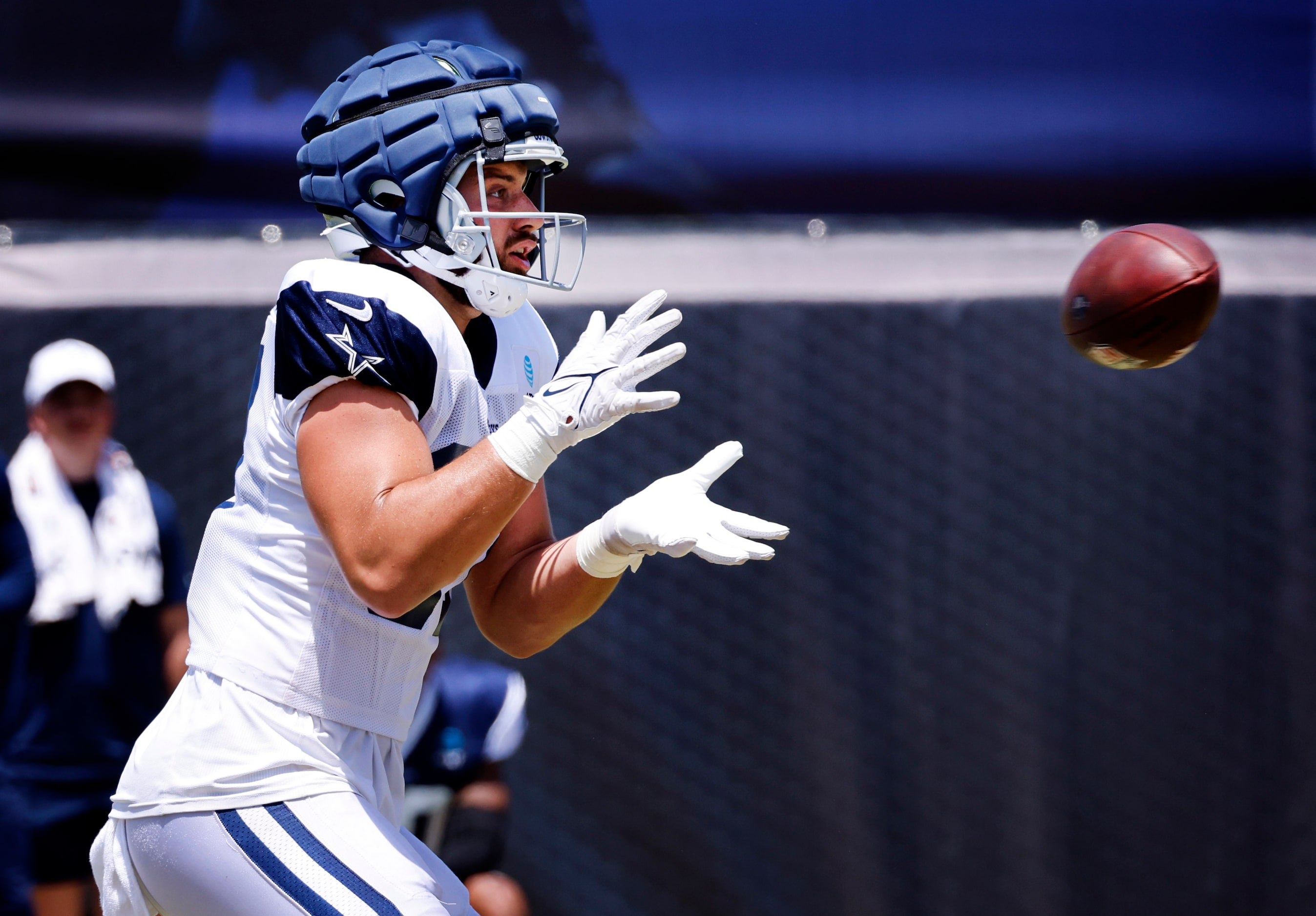 Dallas Cowboys tight end Jake Ferguson (87) catches a Dak Prescott pass at training camp...