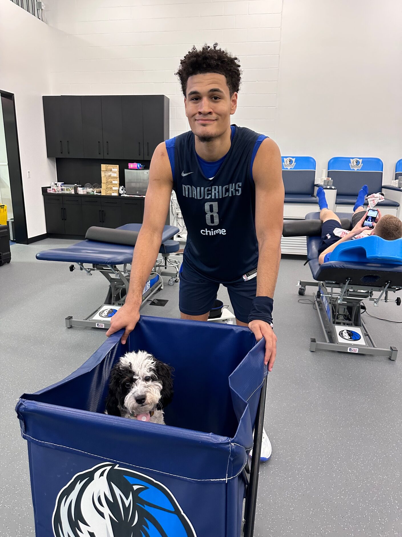 Mavericks guard Josh Green with emotional support dog Bailey