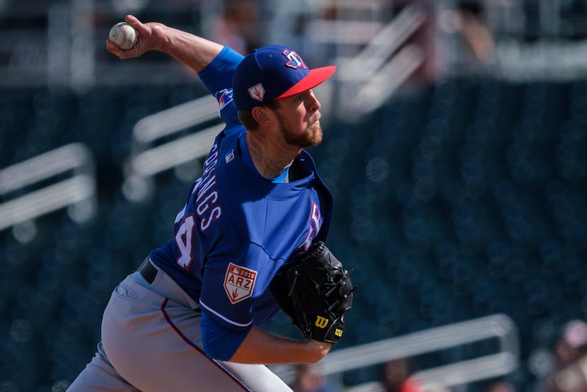 Texas Rangers pitcher Jeffrey Springs pitches during a spring training baseball game against...