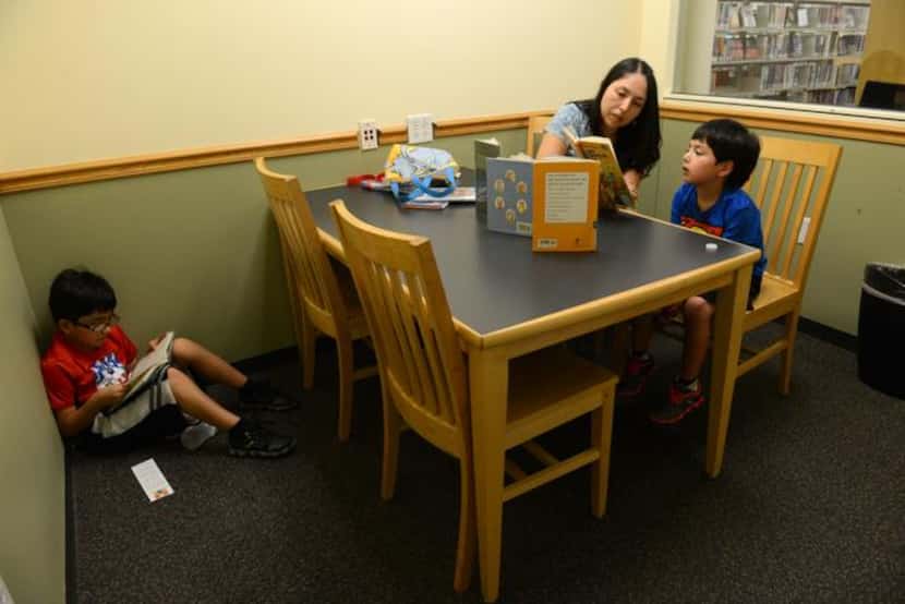 
Ana Alvarado utilizes a study room with her two sons, Moses Alvarado, 7, (left) and Marcos...
