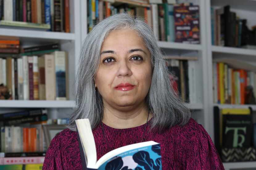 Author and translator Jenny Bhatt holds a copy of her translation of "The Shehnai Virtuoso...