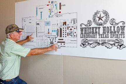 Master distiller and founder Les Beasley points to a map of what was planned for an expanded...