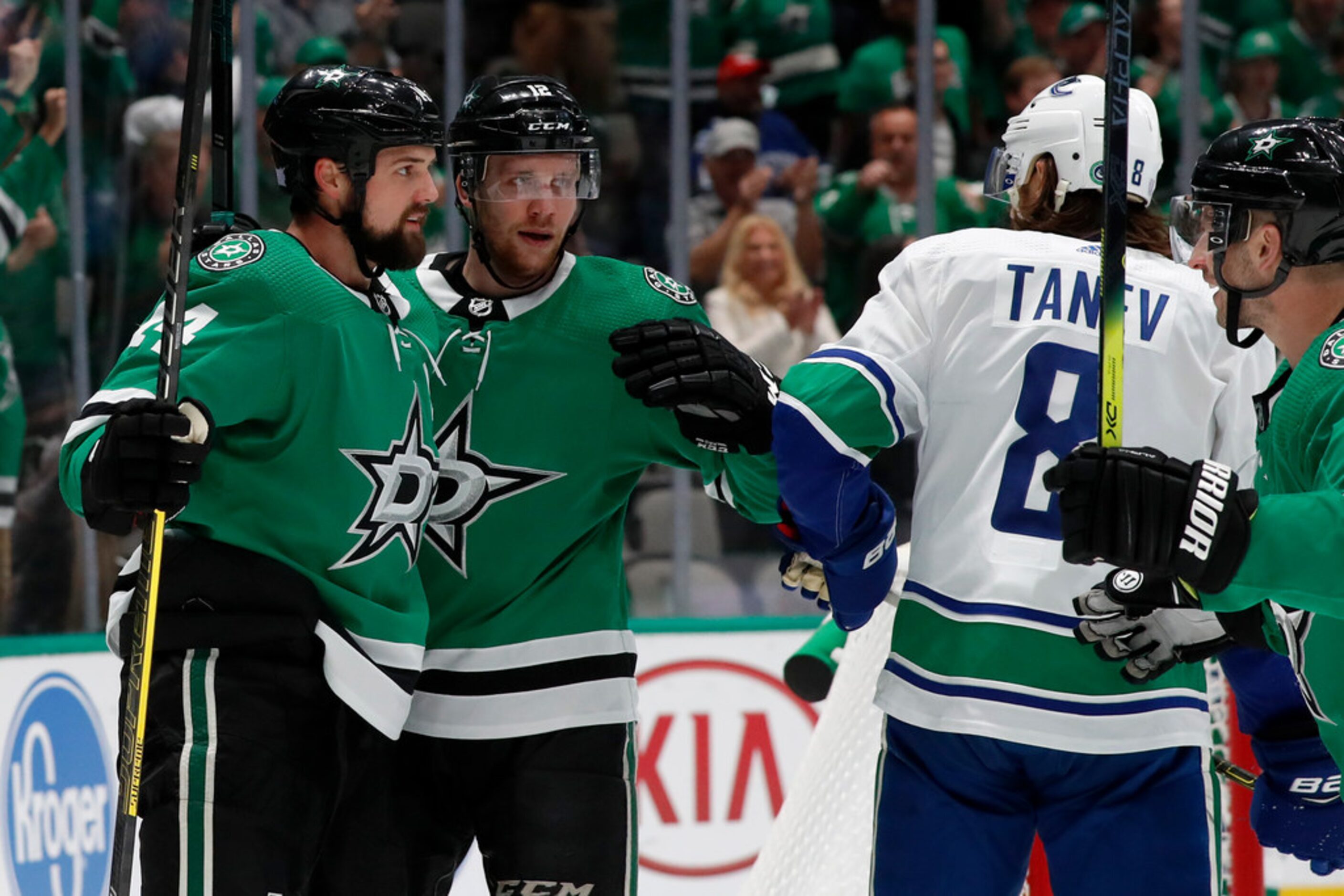 Dallas Stars left wing Jamie Benn (14) and center Radek Faksa (12) celebrate a goal by Benn...