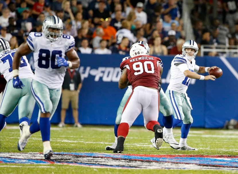 Dallas Cowboys quarterback Kellen Moore (17) looks to pass as Arizona Cardinals defensive...