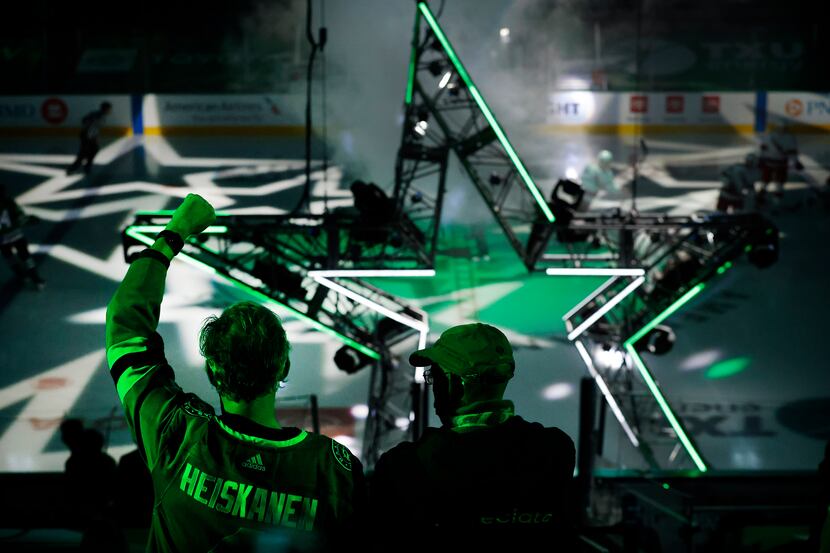Dallas Stars fans cheer their players as they're introduced during the last home game of the...