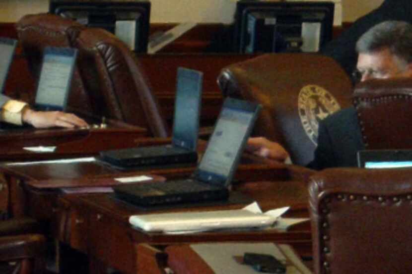 In a frame grab from video, Texas State Rep. Allan Ritter, District 21 (R-Nederland), (left)...