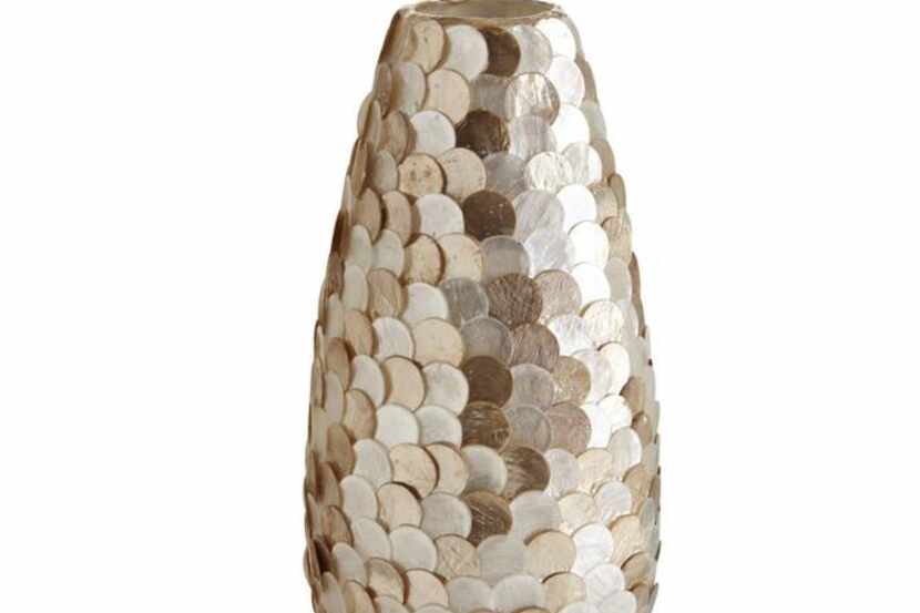 
Pier 1’s handcrafted capiz disco vase ($34.95, pier1.com) is not watertight. Fill it with...