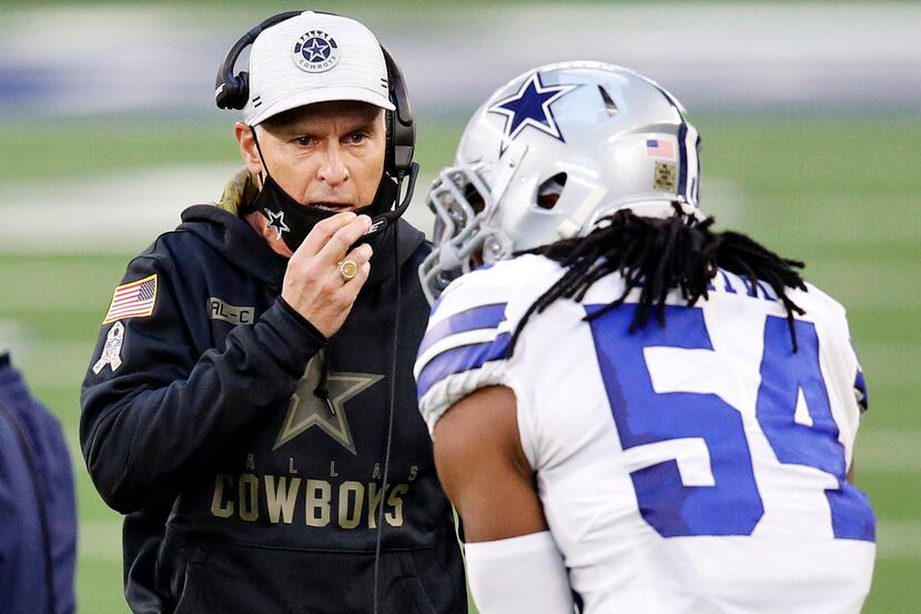 Dallas Cowboys defensive coordinator Mike Nolan listens to middle linebacker Jaylon Smith...