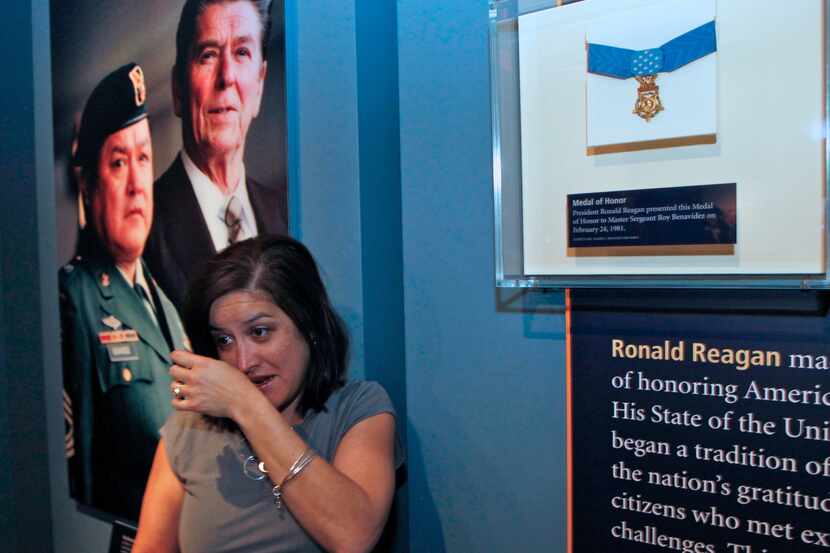 Yvette Benavidez cries as her family unveils the Medal of Honor of her father, Sgt. Roy...