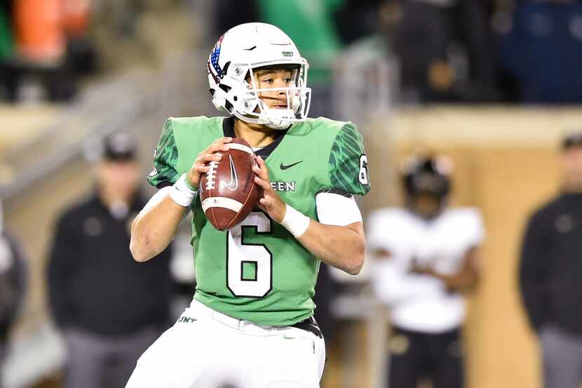 North Texas sophomore quarterback Mason Fine (6) drops back in the pocket and looks for an...
