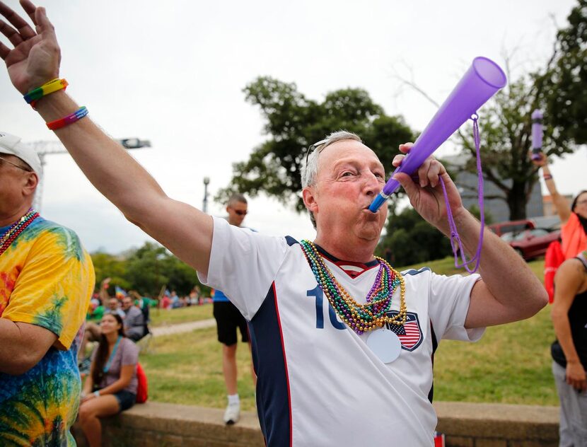 
Gregg Welpe and his horn greeted floats along the Alan Ross Texas Freedom Parade route near...