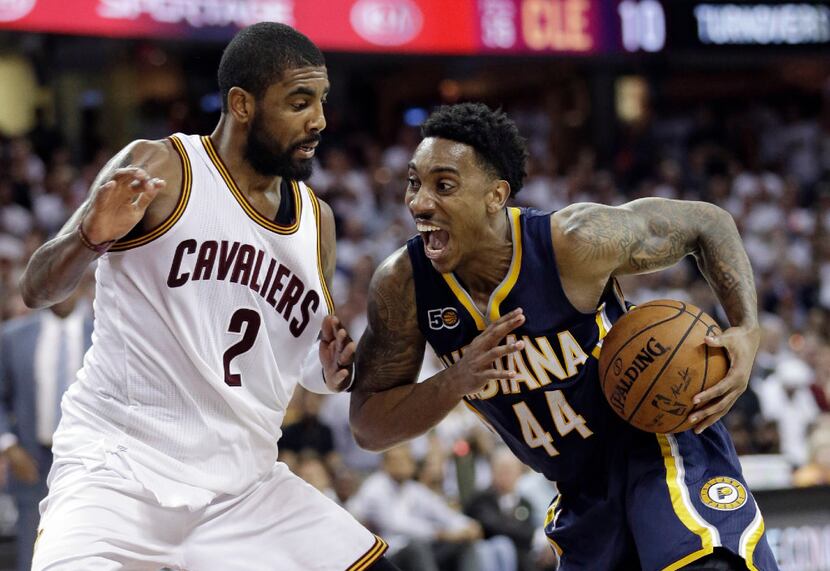 Indiana Pacers' Jeff Teague (44) drives past Cleveland Cavaliers' Kyrie Irving (2) in the...