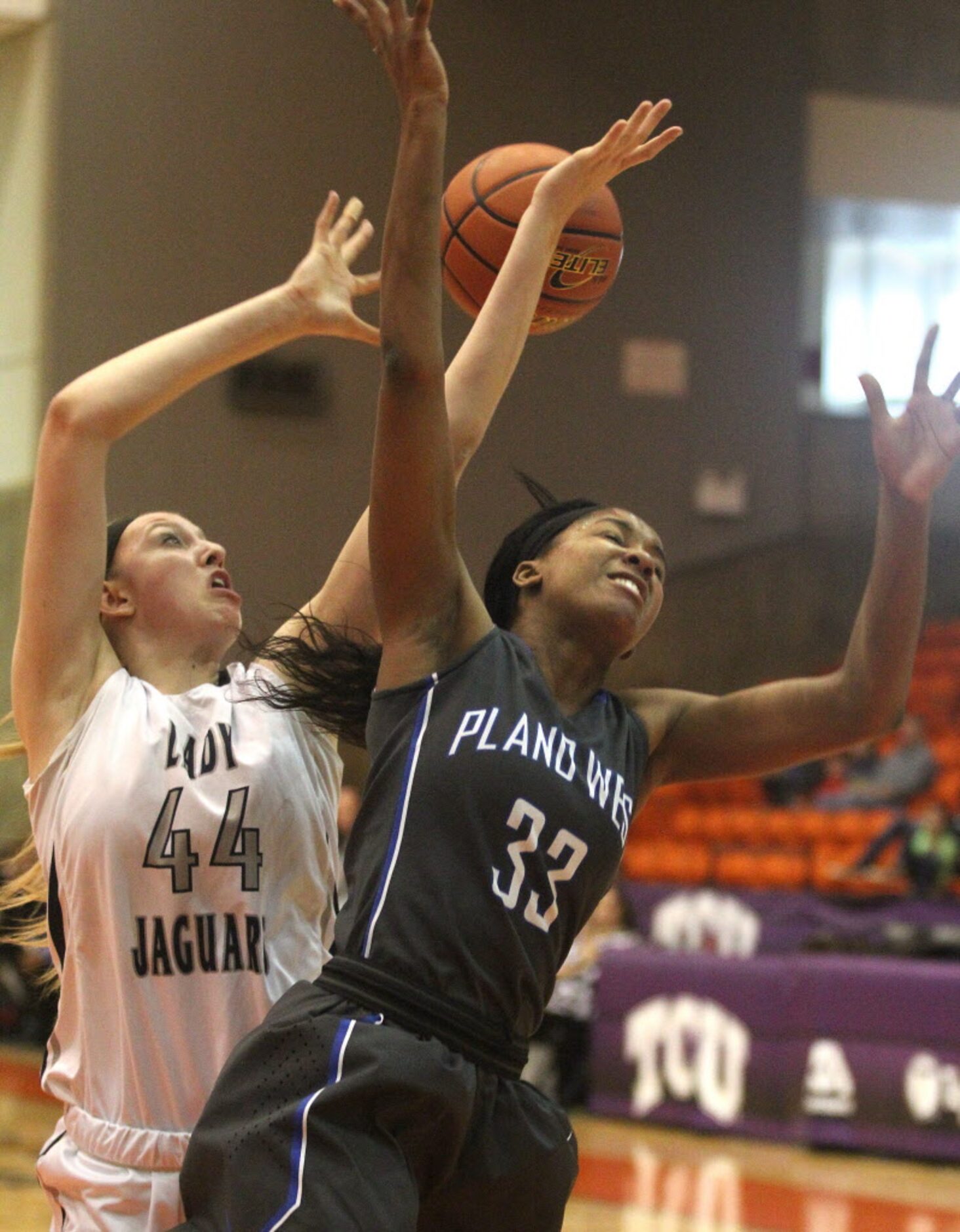 Flower Mound High School junior Lauren Cox (44) and Plano West senior Kyrie McNeil (33)...