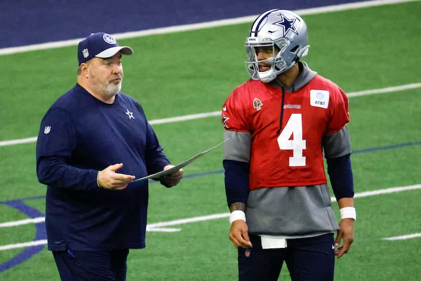 Dallas Cowboys head coach Mike McCarthy (left) talks to quarterback Dak Prescott (4) during...
