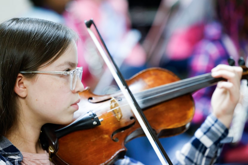 Mariana Lara plays the violin during DSO's Young Musicians Program rehearsal, on Thursday,...