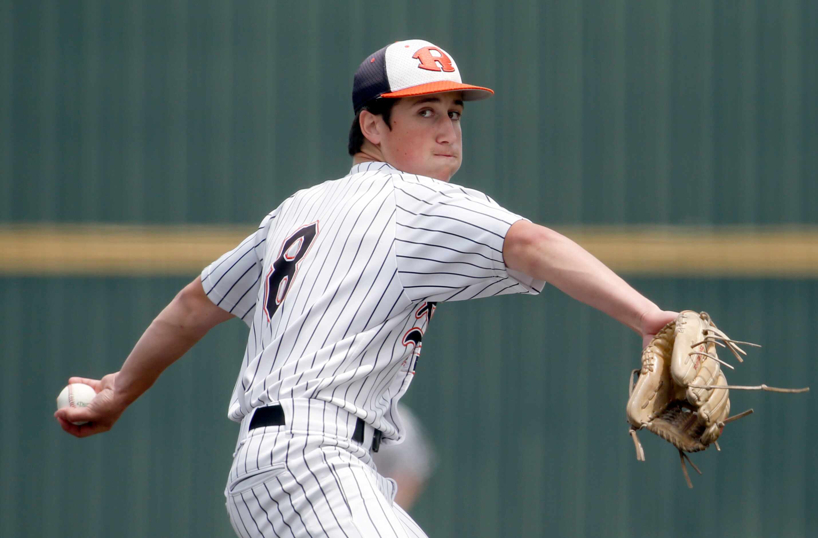 Rockwall pitcher Cade Crossland (8) delivers a pitch during the bottom of the first inning...