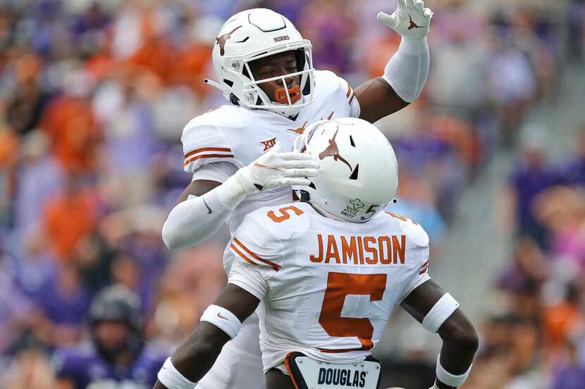 Texas Longhorns defensive back Anthony Cook (11) celebrates the fumble recovery by Texas...
