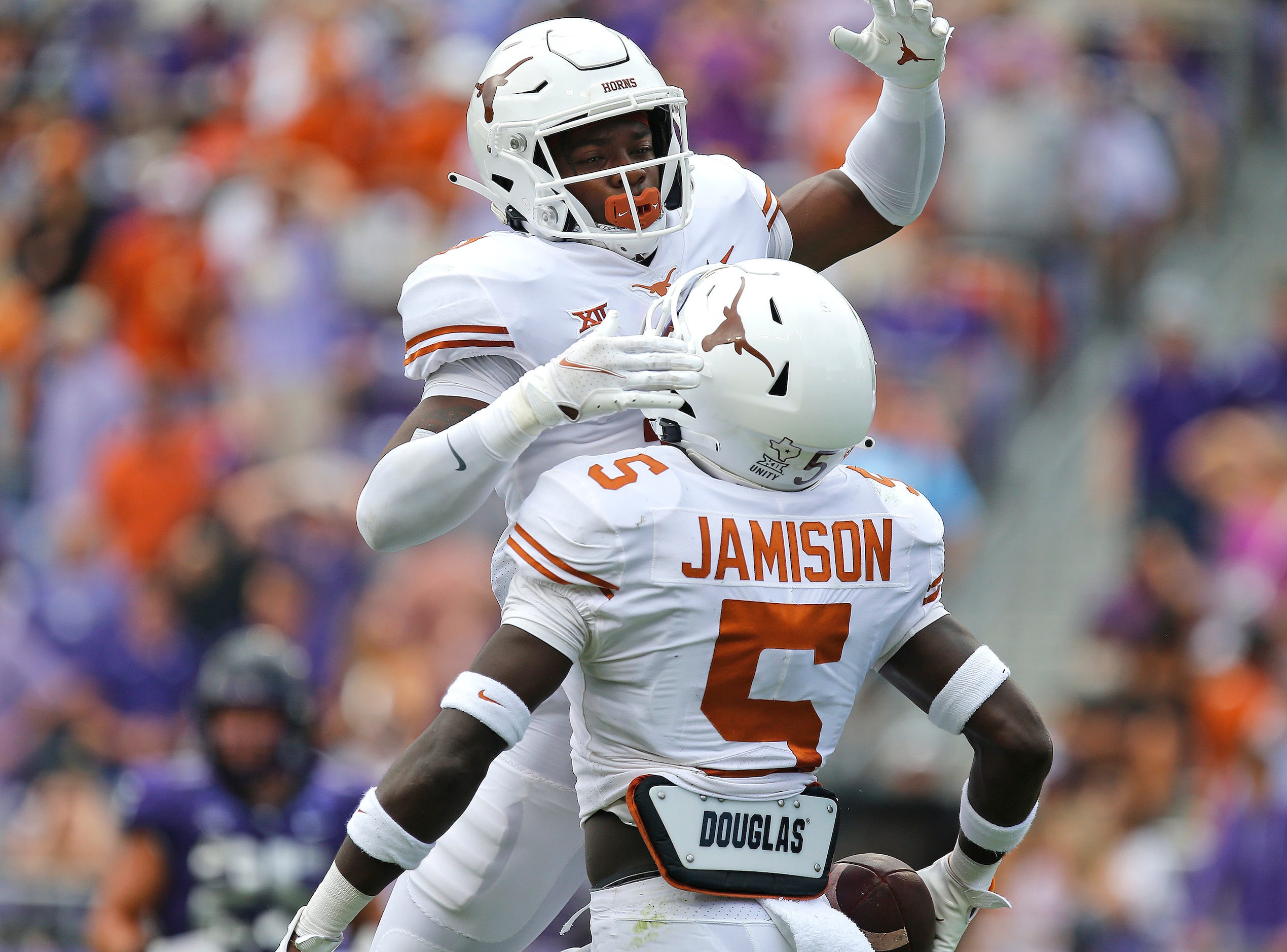 Texas Longhorns defensive back Anthony Cook (11) celebrates the fumble recovery by Texas...