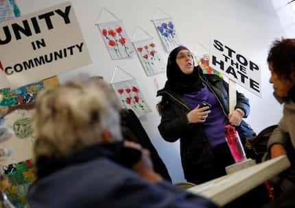 
Alia Salem, a local activist and non-profit executive, speaks to a group during the Facing...