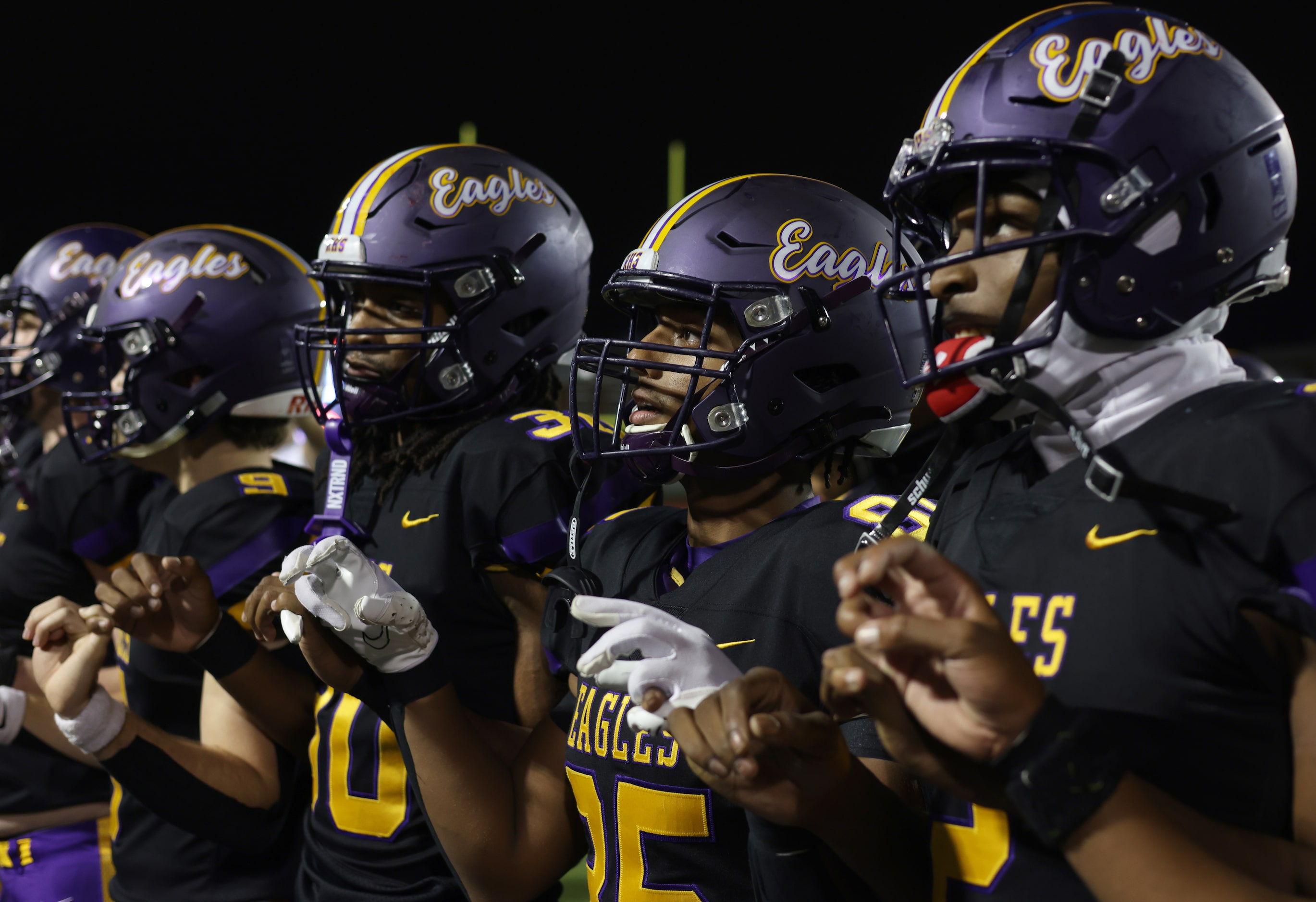 Richardson's Senay Ephriem (85), 2nd from right pauses alongside teammates for the playing...