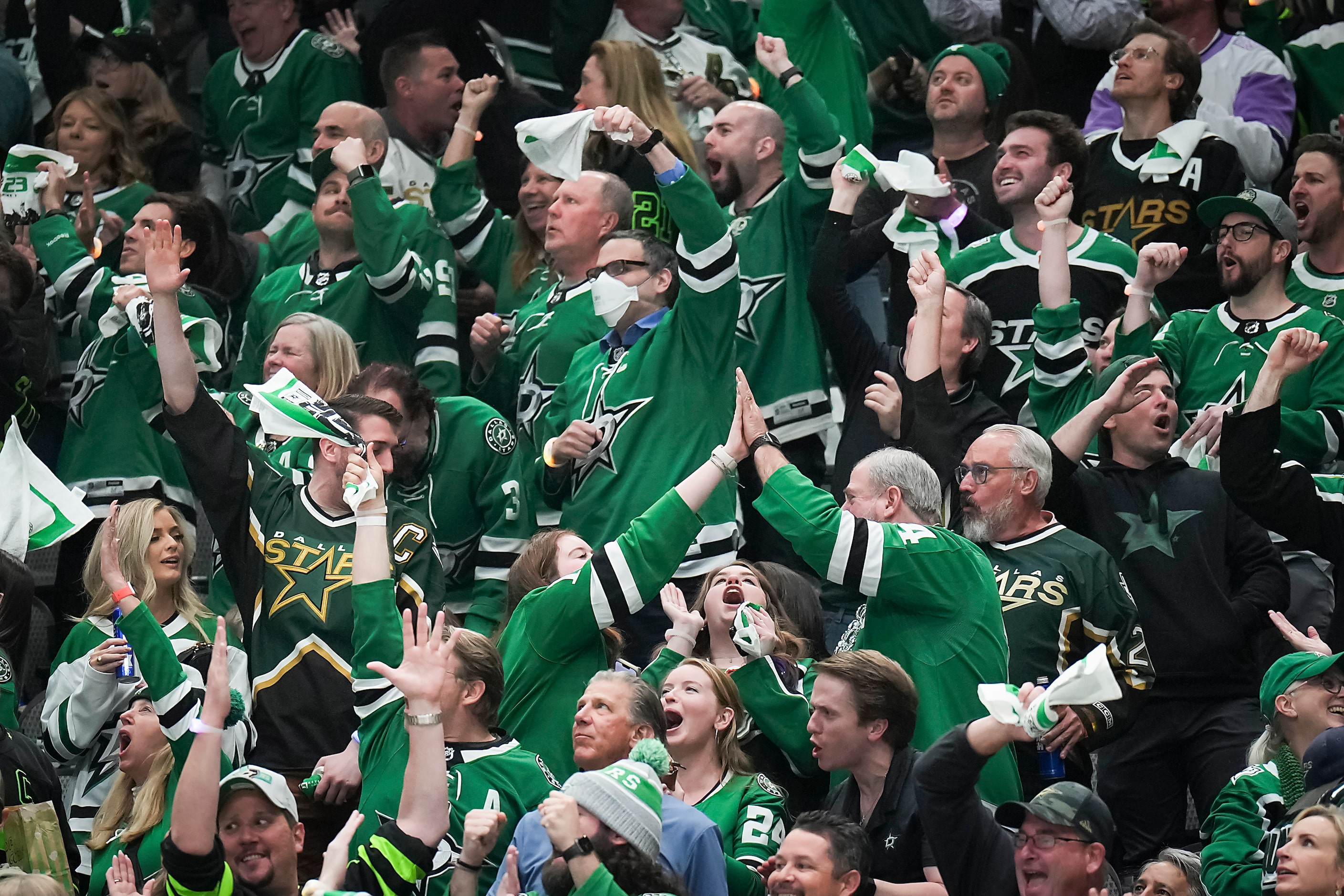 Dallas Stars fans celebrate a goal during the second period in Game 1 of a first-round NHL...