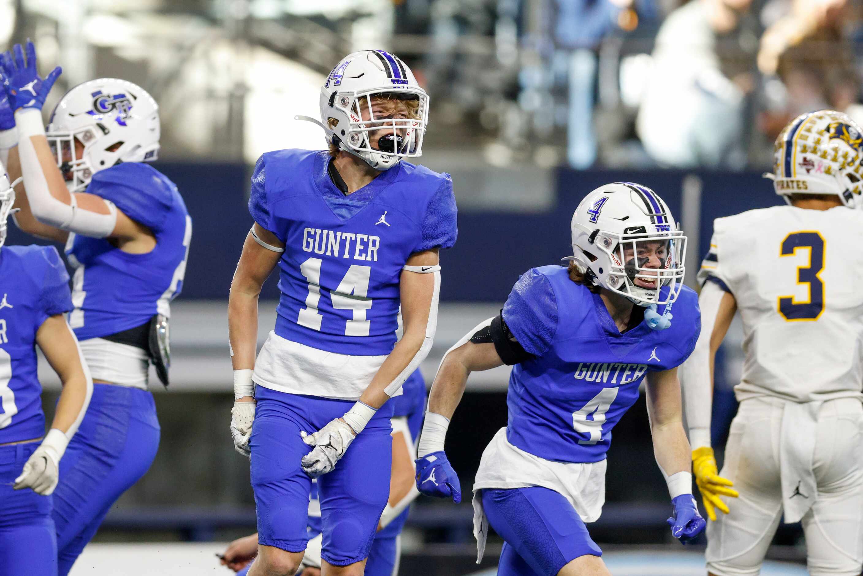 Gunter players celebrate after recovering a fumble on a punt return during the first half of...