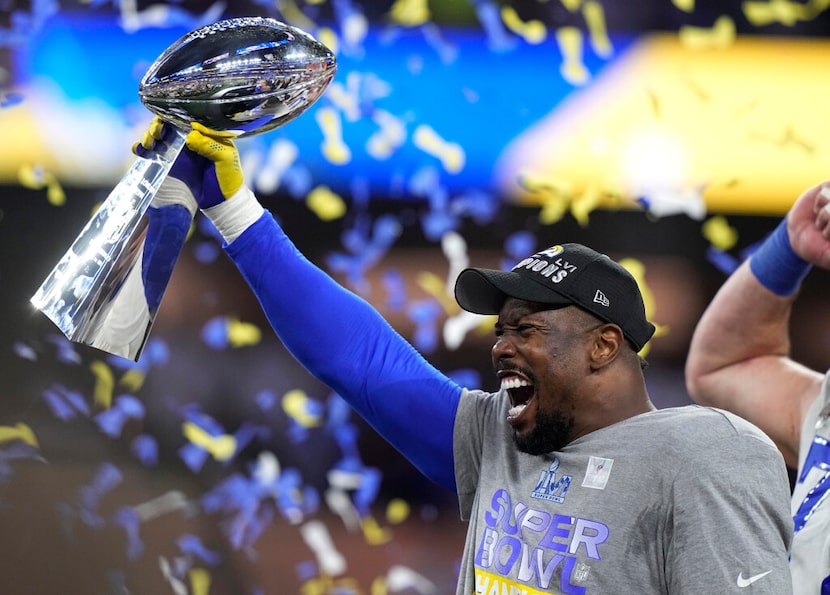 Los Angeles Rams outside linebacker Von Miller holds up the Lombardi Trophy after the Rams...