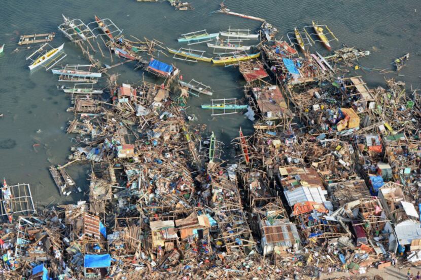 This aerial photo shows destroyed houses along the water in the town of Guiuan in Eastern...