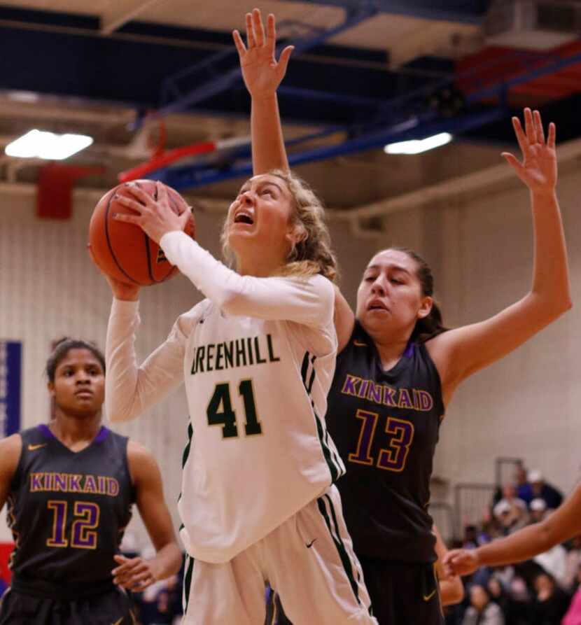 Greenville's Ashley Isenberg (41) shoots between the defense of Houston Kincaid's Kate...