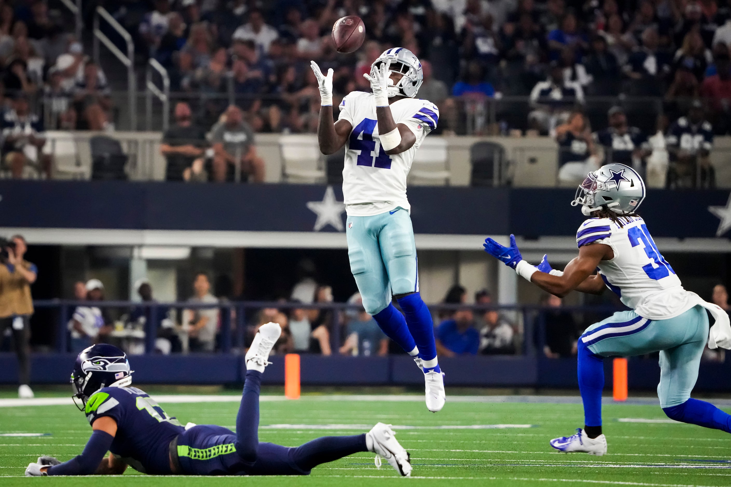 Dallas Cowboys safety Markquese Bell (41) intercepts a pass intended for Seattle Seahawks...