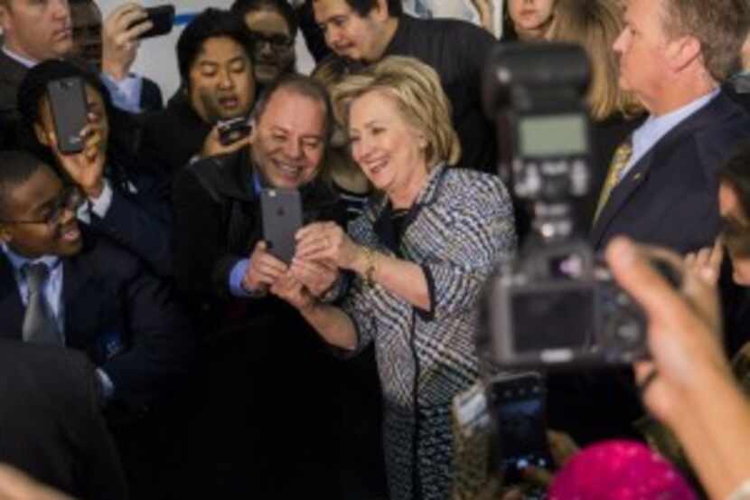  Hillary Rodham Clinton takes a selfie with a supporter at Mountain View College on Tuesday,...