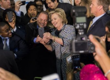  Hillary Rodham Clinton takes a selfie with a supporter at Mountain View College on Tuesday,...