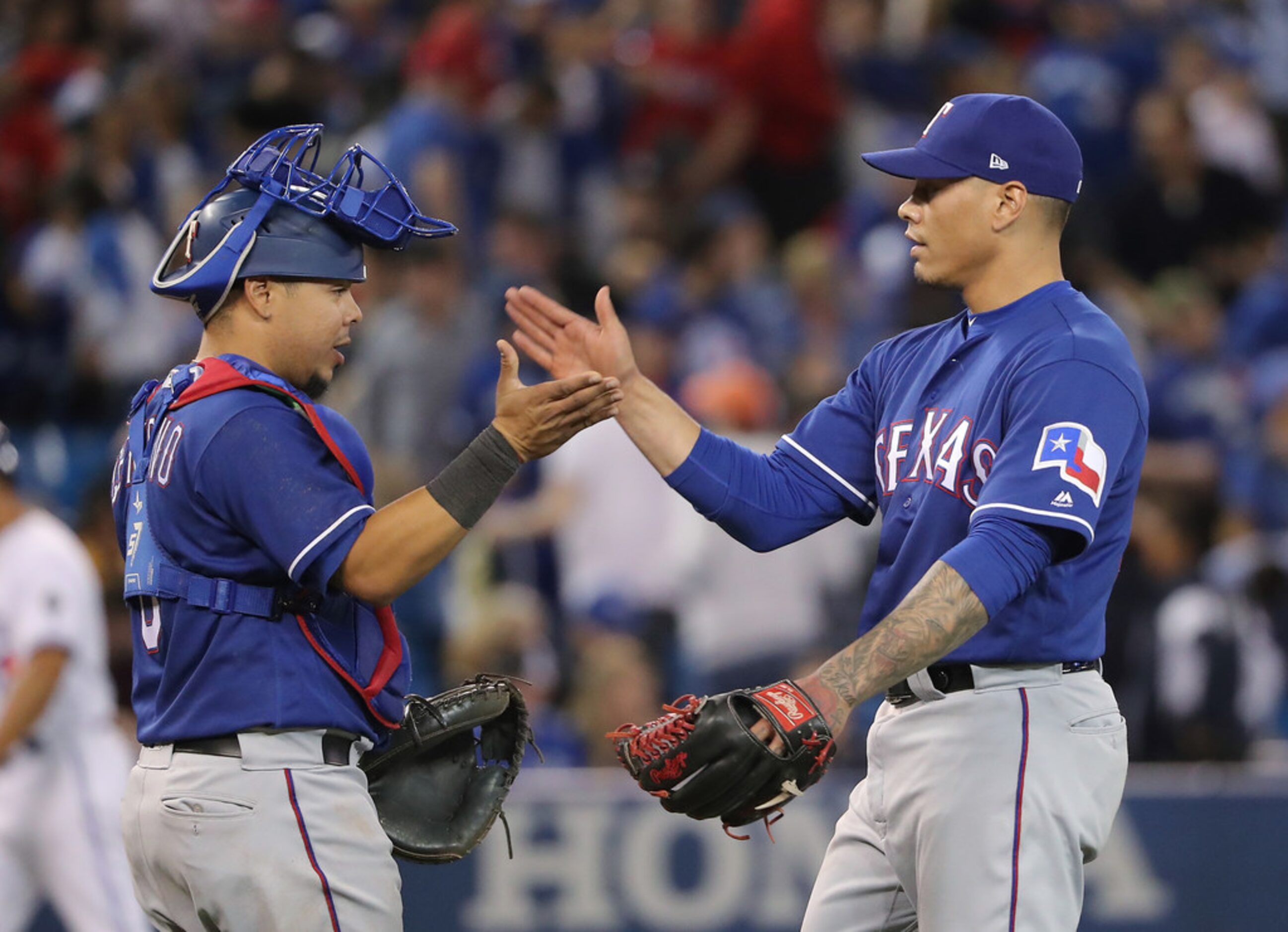 TORONTO, ON - APRIL 27: Keone Kela #50 of the Texas Rangers celebrates their victory with...