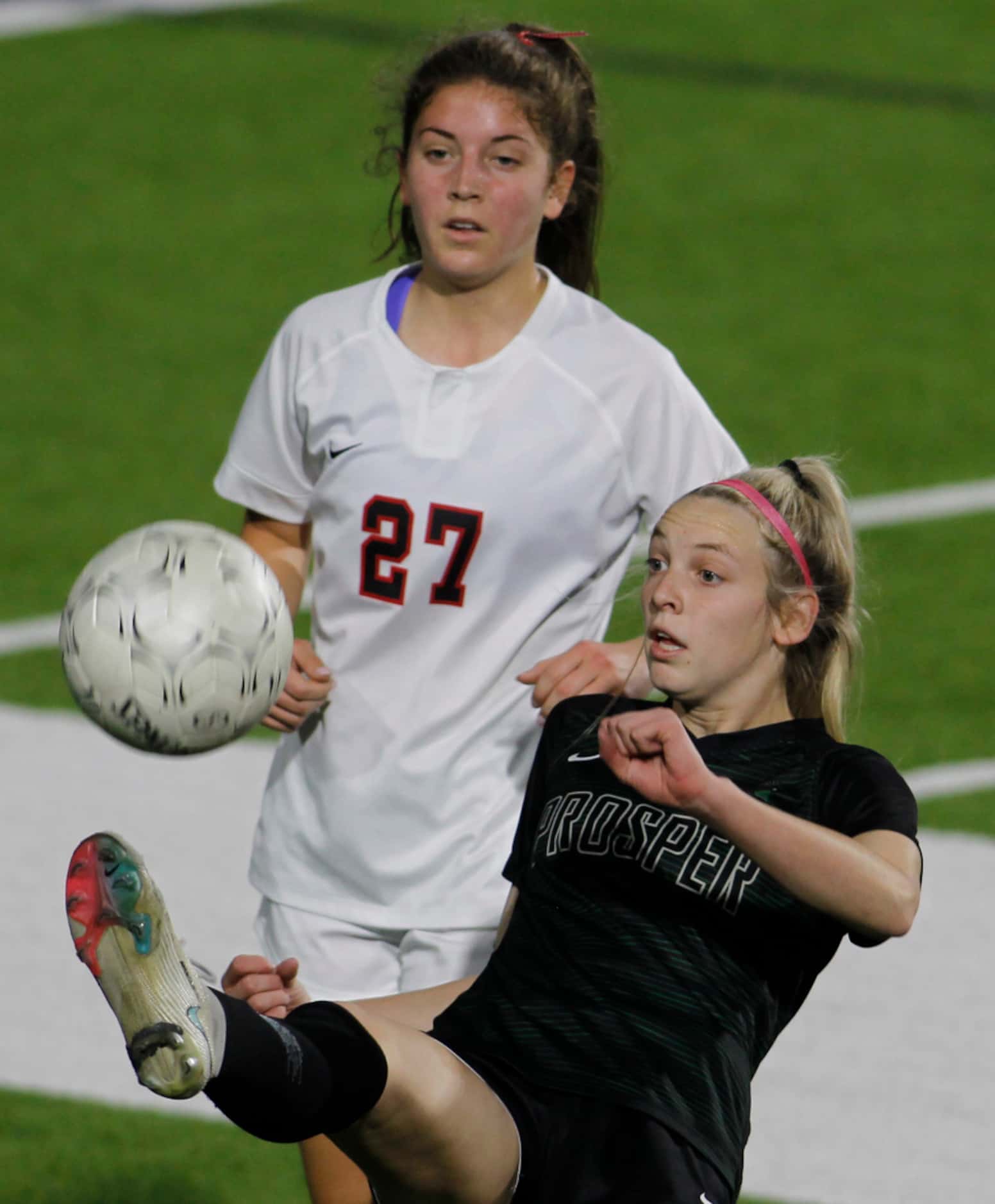 Prosper's Hadley Murrell (10) shows her athleticism as she saves the ball and possession as...