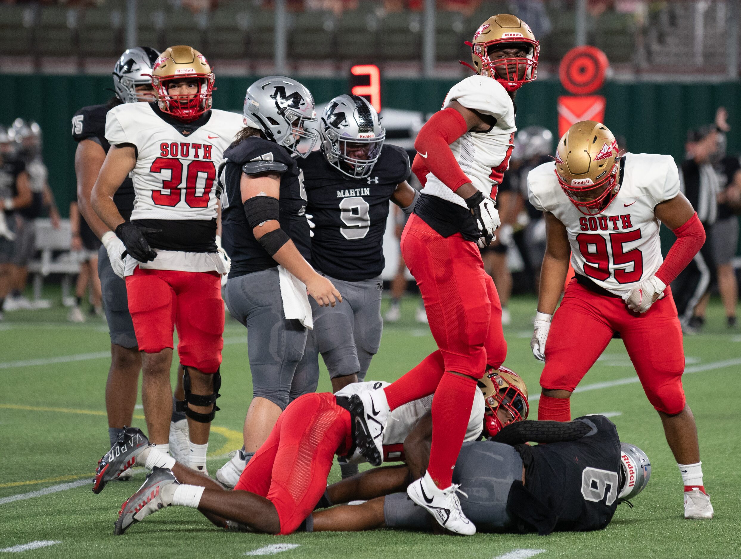 South Grand Prairie senior defensive end Keoni Perkins (46) celebrates as he walks over...