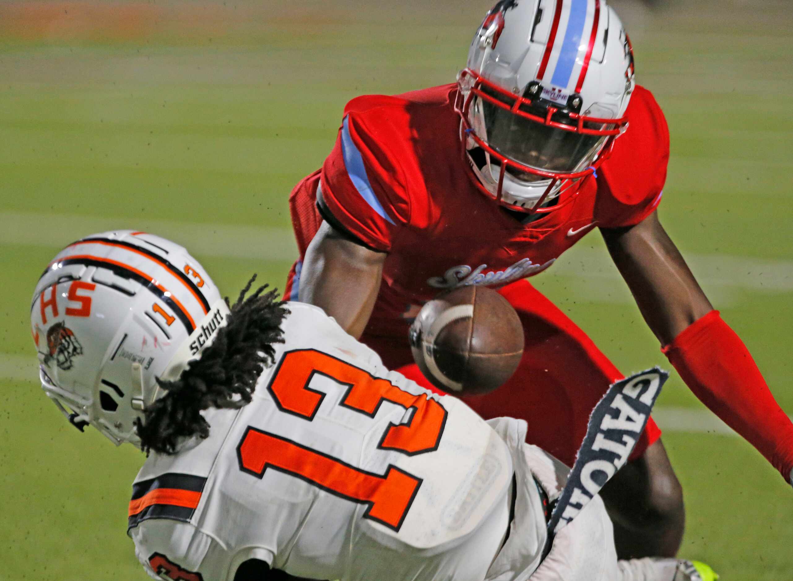 Lancaster’s Jerbrandin Henderson (13) and Skyline’s JacoreyYork (5) battle for a pass during...