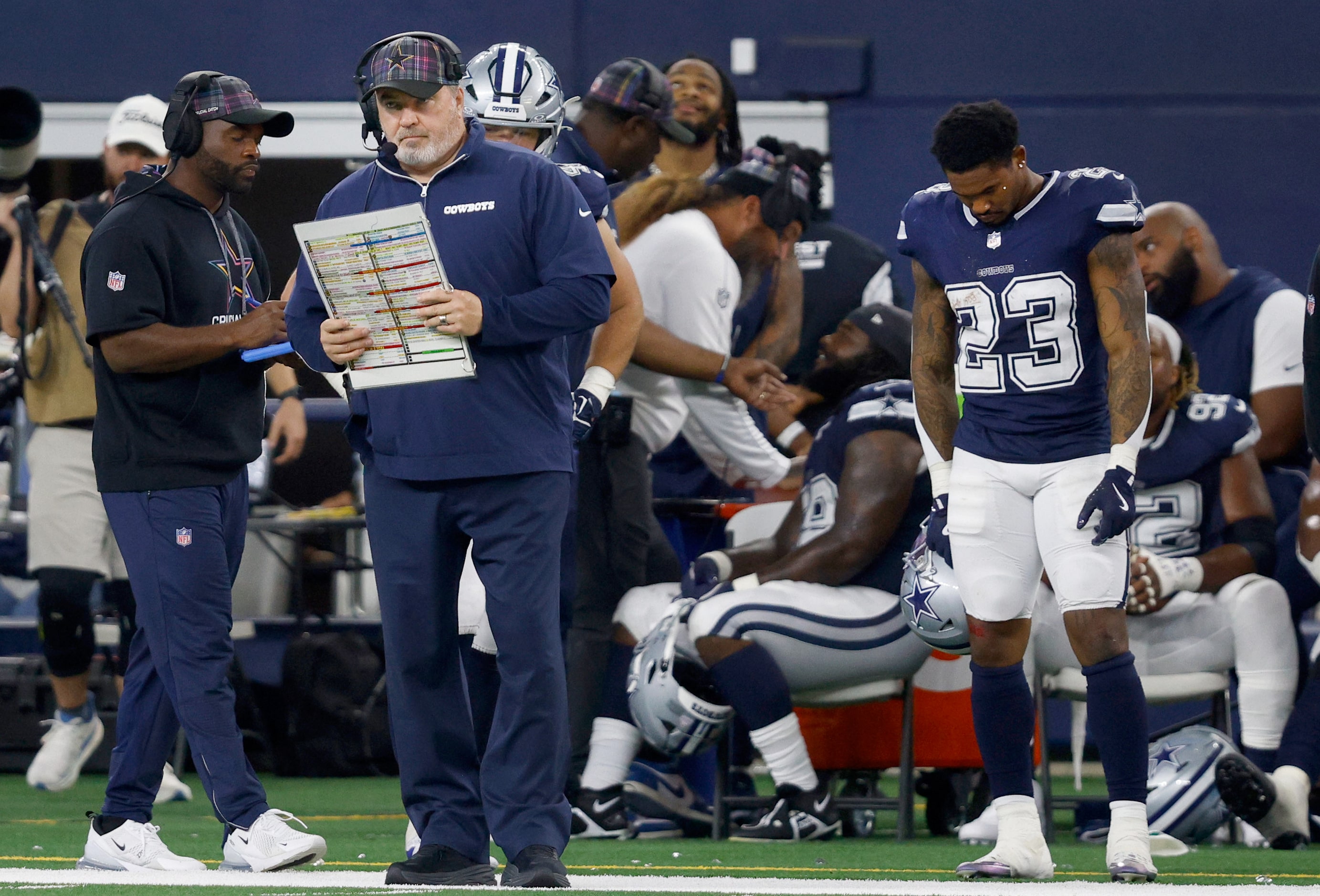 Dallas Cowboys head coach Mike McCarthy, left, watches his players in the second half of an...