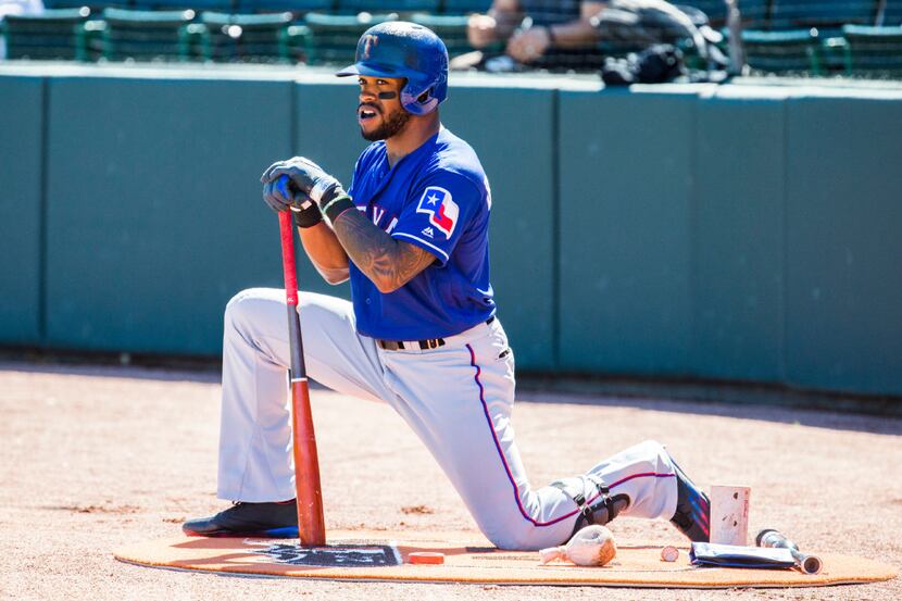 Texas Rangers center fielder Delino DeShields (3) stretches before batting during the first...