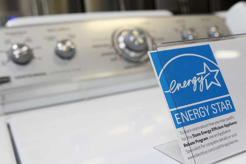 An Energy Star label is displayed on a washing machine at a Best Buy store.