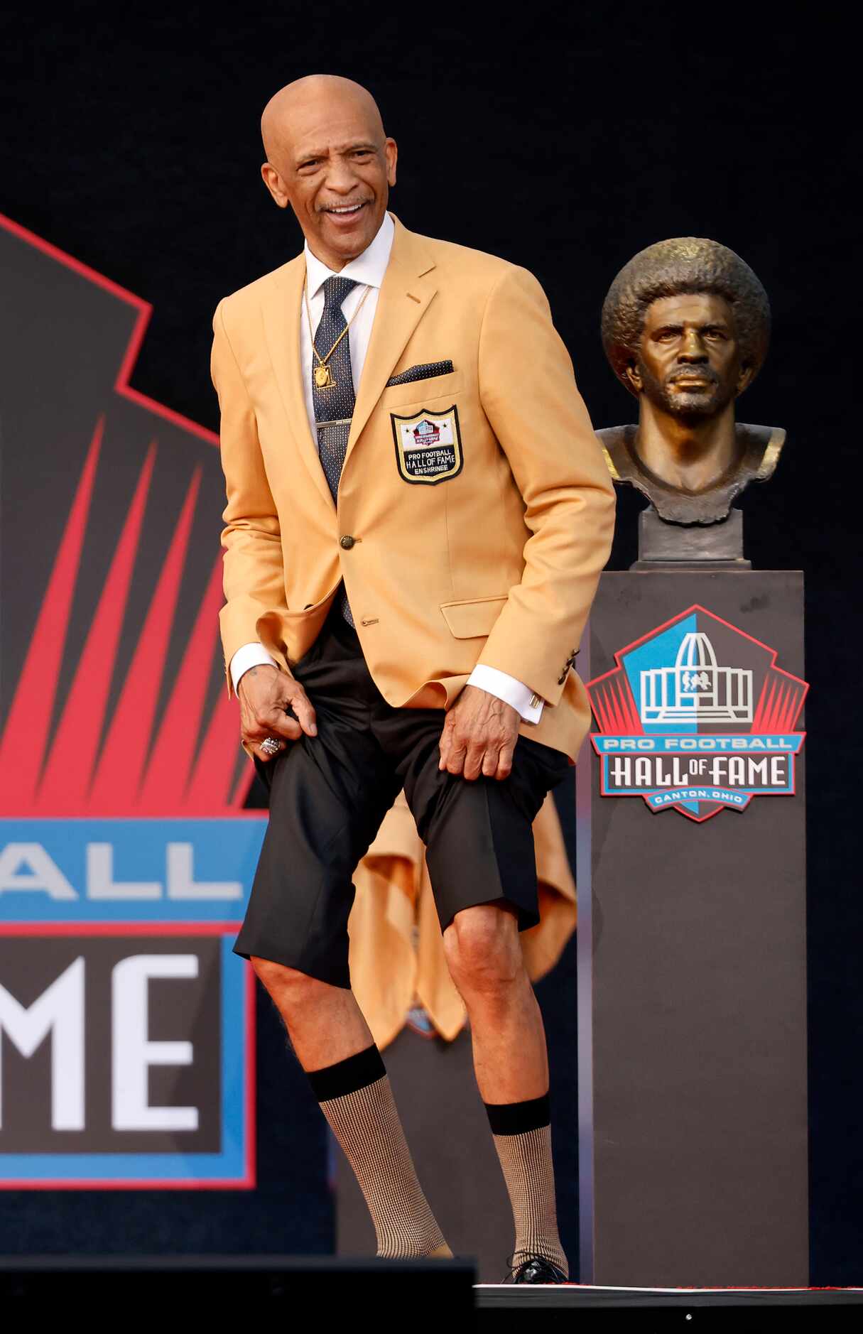 Pro Football Hall of Fame inductee Drew Pearson of the Dallas Cowboys hikes his pants to...