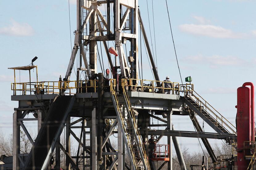 Work continues on a drilling rig off Texas State Highway 72 east of Tilden, Texas, Thursday,...